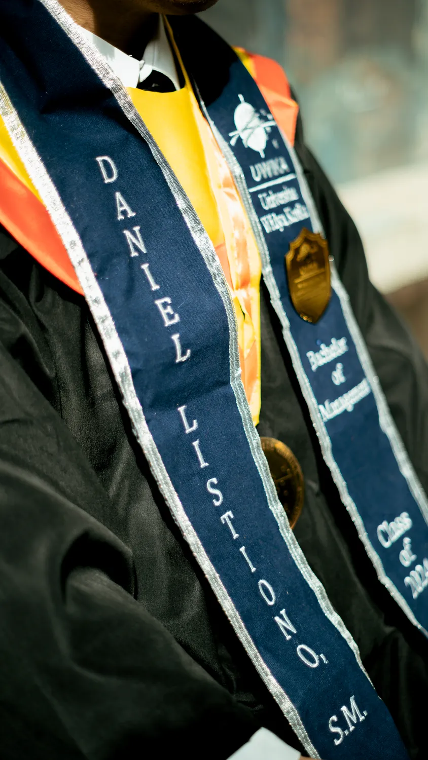 Candid graduation moment with family, Widya Kartika Surabaya — graduation photography services Surabaya